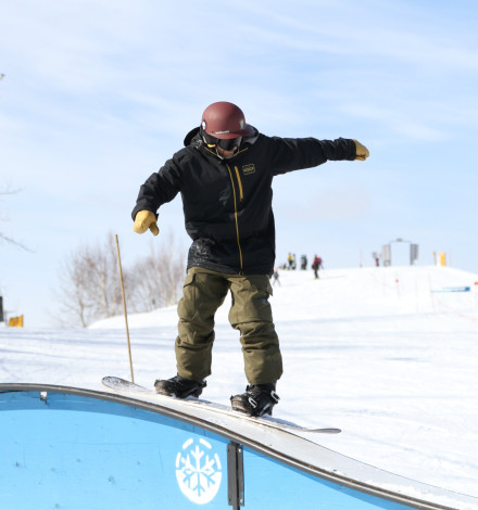 Snowboarder on rail