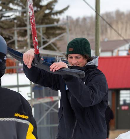 Lift Operator Helping Guest with T-Bar Lift Operator Helping Guest with T-Bar